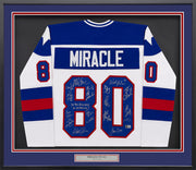 1980 Team USA Miracle on Ice Autographed Framed White Jersey "Do You Believe In Miracles?!" With 18 Signatures Including Eruzione & Craig Beckett BAS Witness Stock #262550