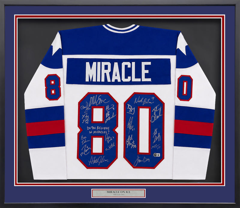 1980 Team USA Miracle on Ice Autographed Framed White Jersey "Do You Believe In Miracles?!" With 18 Signatures Including Eruzione & Craig Beckett BAS Witness Stock #262550