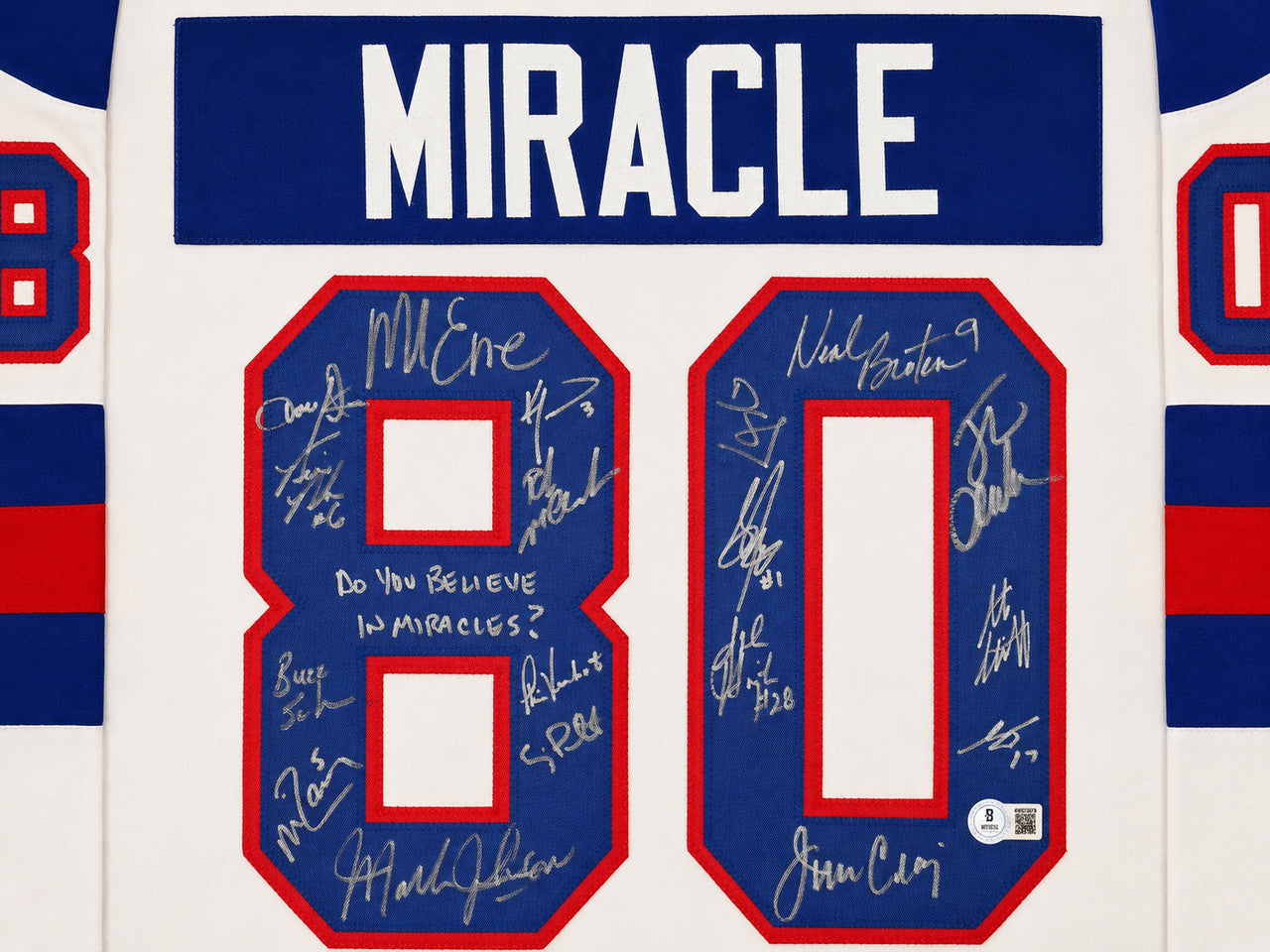 1980 Team USA Miracle on Ice Autographed Framed White Jersey "Do You Believe In Miracles?!" With 18 Signatures Including Eruzione & Craig Beckett BAS Witness Stock #262550