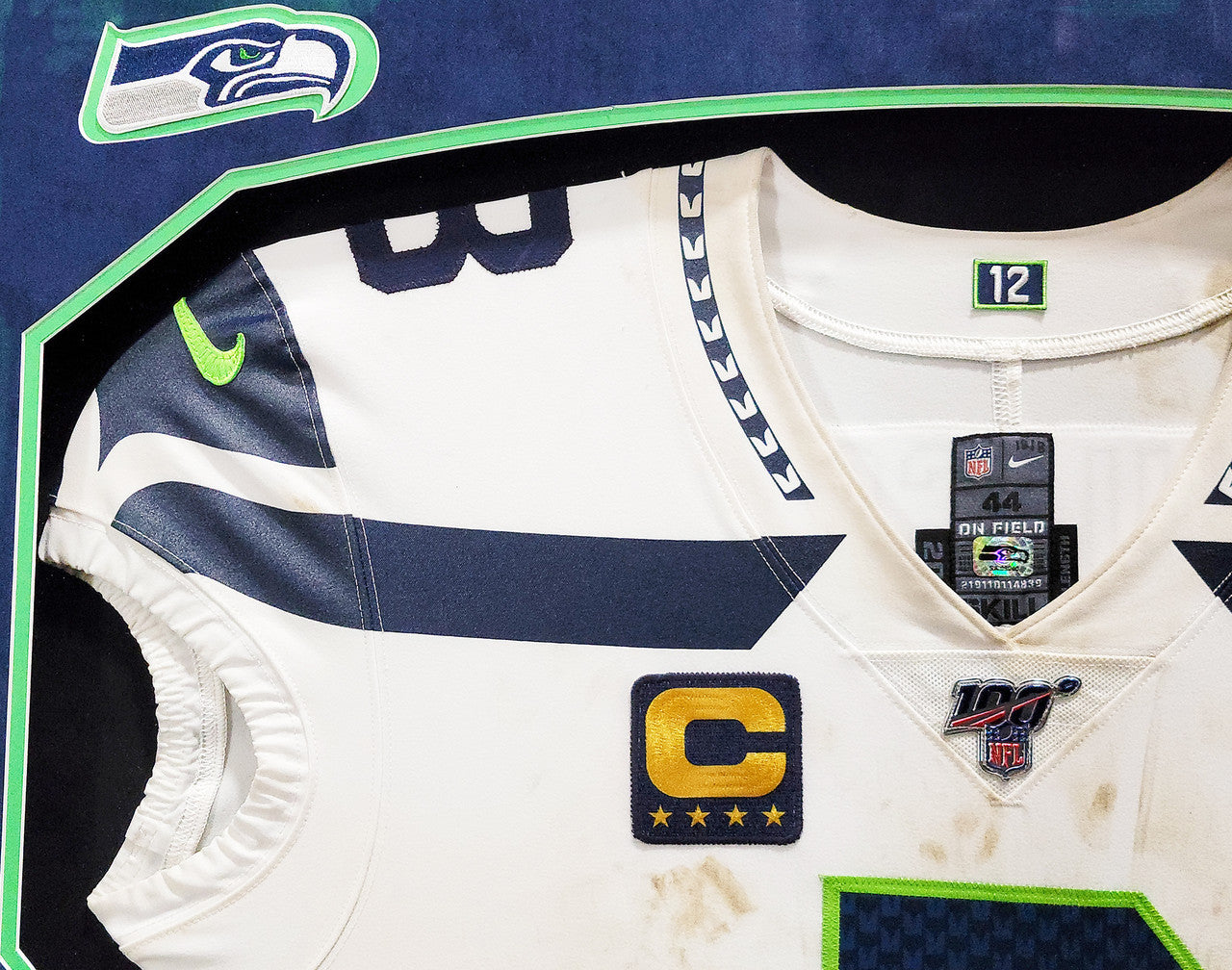 Russell Wilson Framed Game Used Seattle Seahawks White Nike Jersey With Captain's Patch & NFL 100 Logo Unsigned SKU #203517