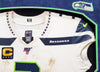 Russell Wilson Framed Game Used Seattle Seahawks White Nike Jersey With Captain's Patch & NFL 100 Logo Unsigned SKU #203517
