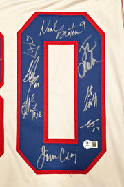 1980 Team USA Miracle on Ice Autographed White Jersey "Do You Believe In Miracles?!" With 18 Signatures Including Eruzione & Craig Beckett BAS Witness Stock #254436