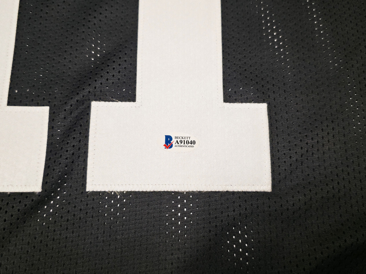 Las Vegas Raiders Henry Ruggs III Autographed Black Jersey Beckett BAS Stock #256890